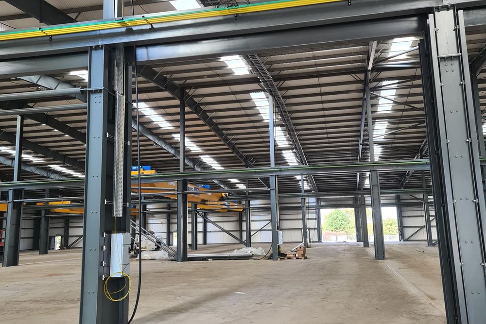 Empty industrial unit with new containment ready for fit out