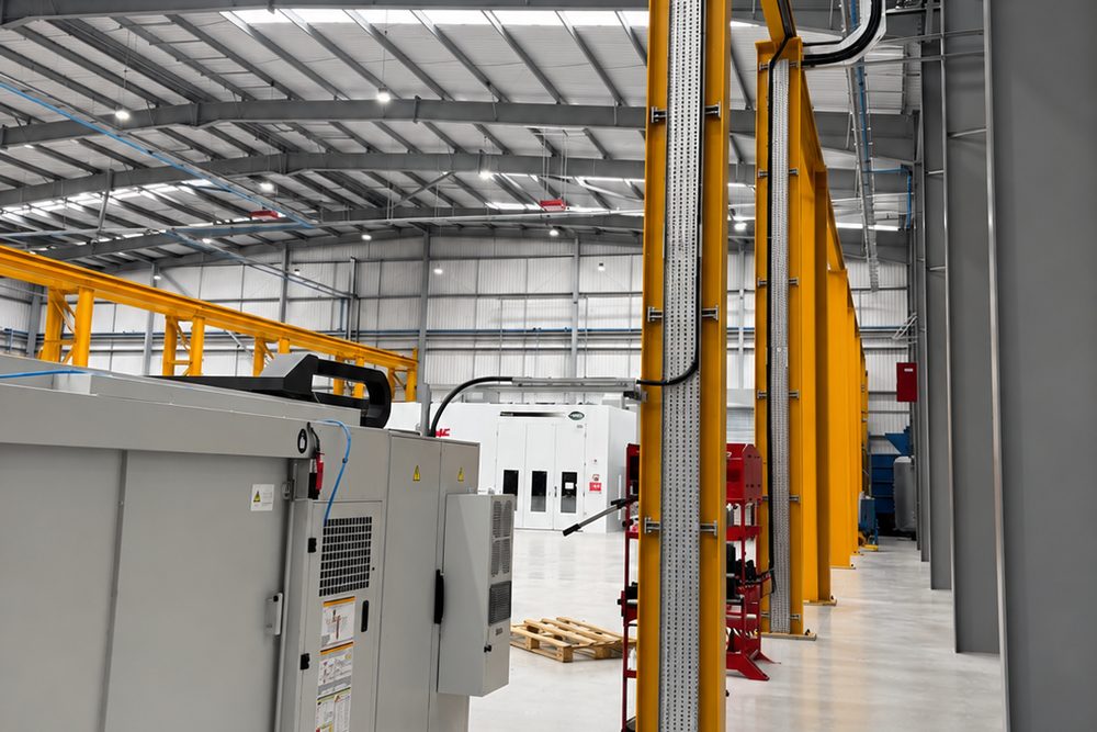 Containment and power supply drops serving production machinery